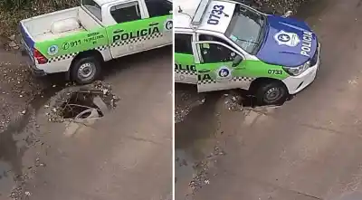 Un patrullero del 911 quedó atrapado en un pozo y los vecinos filmaron más caídas