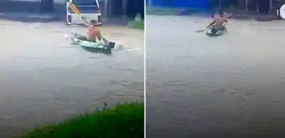 La insólita postal del temporal: un hombre navega en kayak por una avenida capitalina